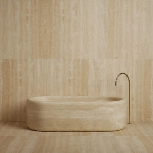 Continuous Curved Corner Stone Bathtub Elongated Oval Outline Layered Travertine Vein Texture Open Concept Luxury Spa Bathtub